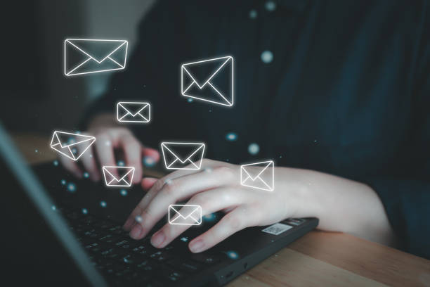 istock E-mail spam or email marketing concept, Communication connection message in the workplace. Woman using computer laptop and receive new multiple email. 2151858200