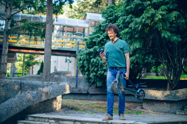 Man walking with electric push scooter