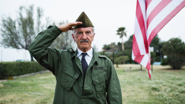 istock Sad Elderly Veteran Remembers Fallen In Second War at Memorial Day Cemetery 2151858795