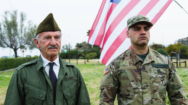 istock American Military General And Sergeant Standing At Attention In Memorial Park 2151859001