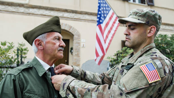 Son Fixes Father's Veteran Tie on Memorial Day in America.