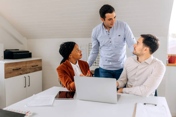 istock Colleagues discussing work at the office together 2151859925