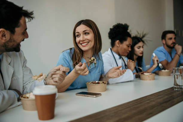 Diverse doctors and nurses having a lunch together
