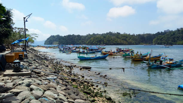 istock Tourist boat anchored on the beach 2151860827