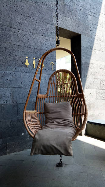 istock Hanging rattan chair with pillow on top 2151860838