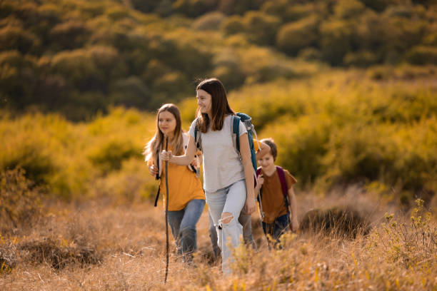istock Children whit backpack walking on the hill 2151860848