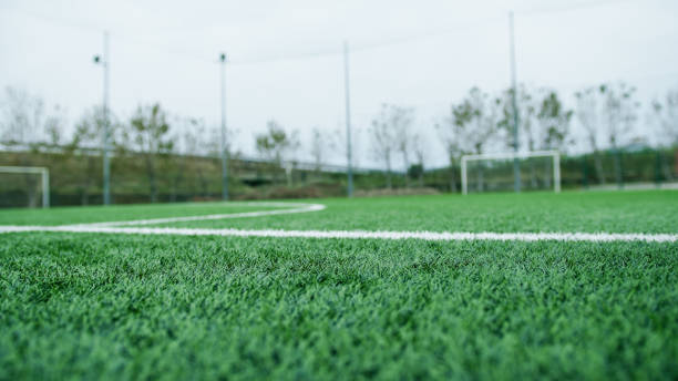 istock Synthetic Green Soccer Field Grass 2151860909