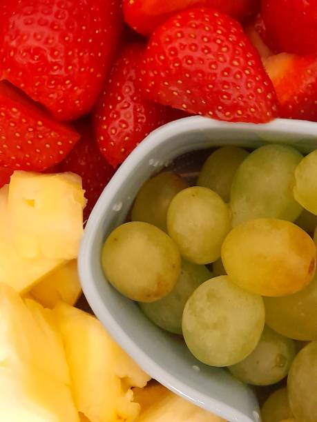 istock Strawberry, grape and pineapple together 2151864293