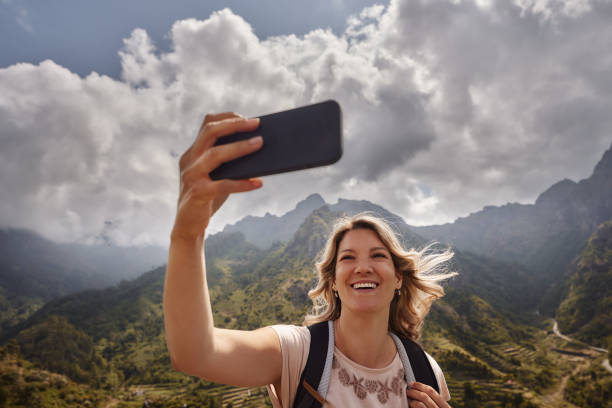istock Happy hiker taking a selfie on a mountain. 2151864821