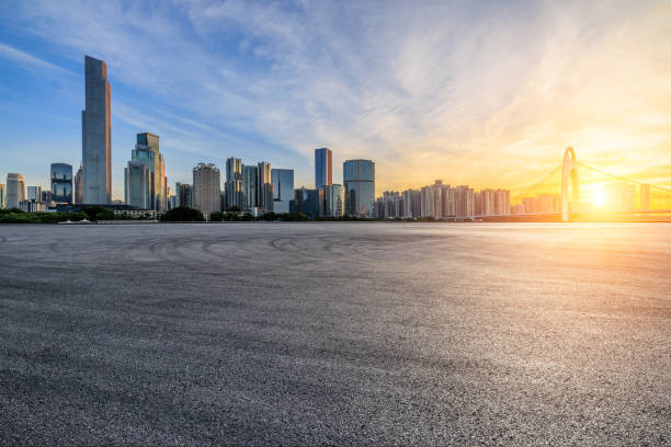istock Road square and city buildings background 2151865357
