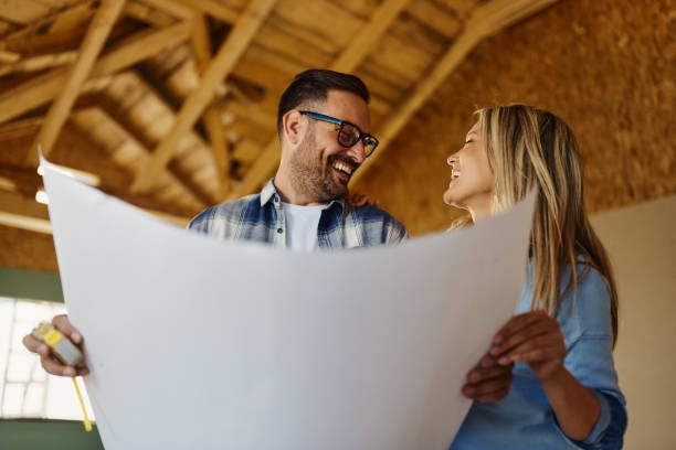 istock Happy couple talking about housing plans at construction site. 2151866907