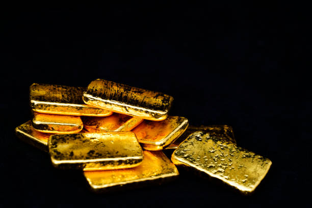 istock Close up photo a gold bars on black background 2151867218