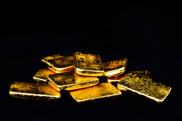 istock Close up photo a gold bars on black background 2151867413