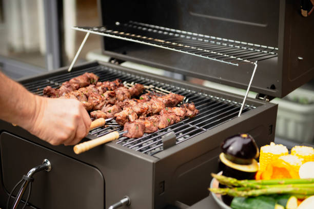 istock cook barbecue outdoors 2151867970