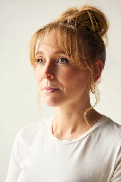 istock Portrait Of Smiling Casually Dressed Woman Against Neutral Plain Studio Background 2151868093