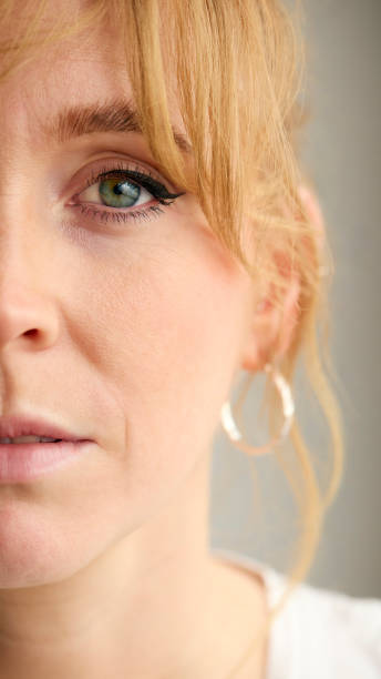 istock Close Up Portrait Of Woman Against Neutral Plain Studio Background 2151868263