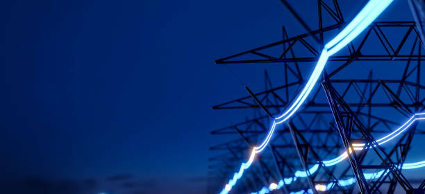 istock High voltage electric transmission tower with glowing current line, electrical power transmit through wire to city and house at night, Renewable green energy grid infrastructure concept 3d rendering 2151869379