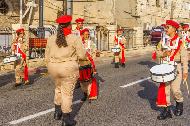 Details of hands playing the bass drum during a popular festival in northern Italy