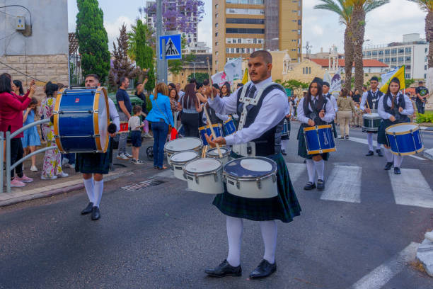 Haifa, Israel - May 04, 2024: Local Arab Orthodox Christians celebrate Easter Holy Saturday by a parade in Scottish dressing. Downtown Haifa, Israel