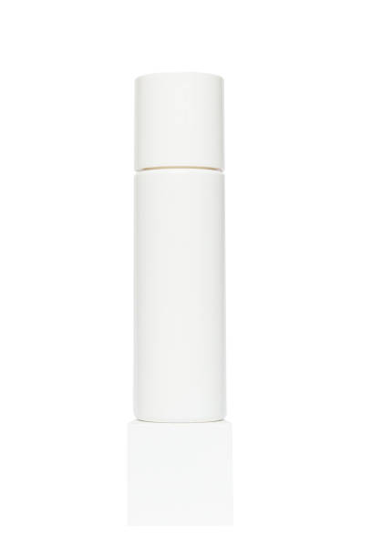 istock white plastic bottle package for body cosmetics on a white cube podium. Container lotion, tonic, serum, cream, bottle mockup isolated on white background 2151871063
