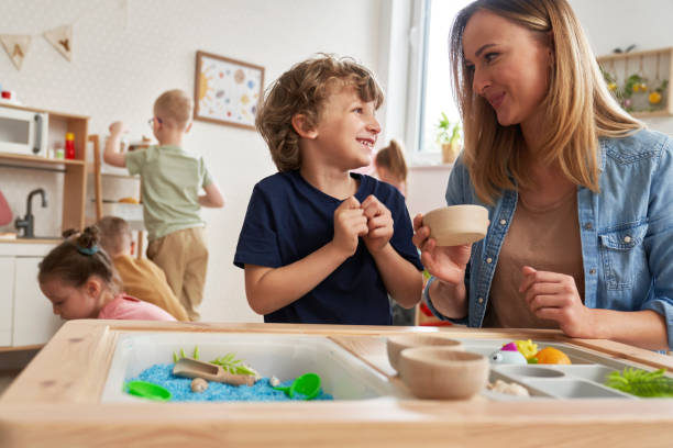 istock Physiotherapist doing sensory exercises with children 2151871927