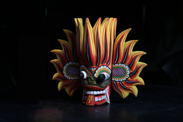 Sri Lanka - traditional mask black background. wood carvings Fire Mask - Wooden Mask from Sri Lanka. Lankan Fire Devil mask, Gini Raksha,