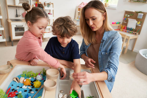 istock Physiotherapist performs exercises to the children 2151872386