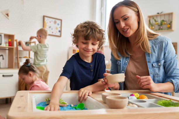 istock Physiotherapist doing sensory exercises with children 2151872604