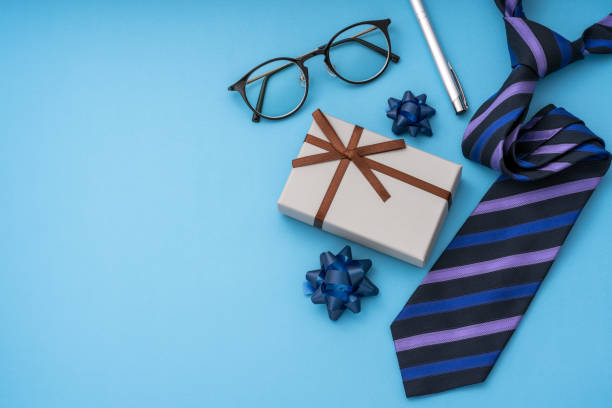 istock Father's Day image. Tie, gift box, glasses and pen. 2151872857
