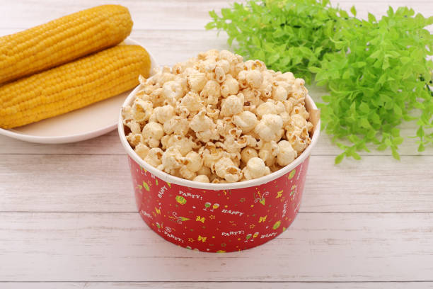 A large serving of popcorn served in a cup