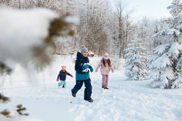 istock Happy kids enjoying winter snow 2151880425