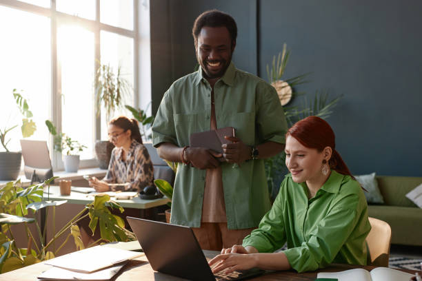 Smiling People Working Together in Office with Sunlight