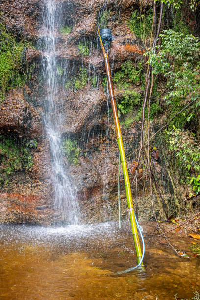 istock Small waterfall with devices to collect fresh water 2151881621