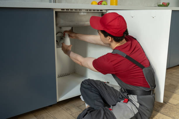 istock Professional Plumber Repairing Kitchen Sink Pipe During Daytime Service Call 2151882053