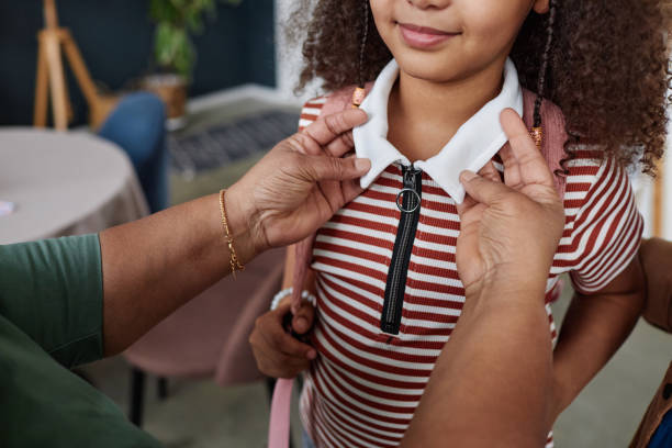 istock Woman Helping Daughter Getting Ready for School 2151882609