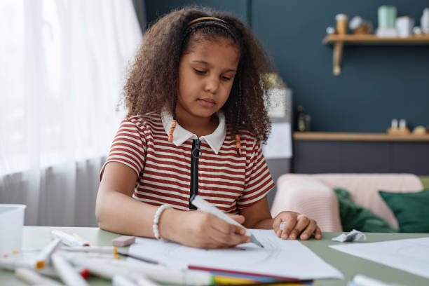 istock Black girl drawing picture 2151882647