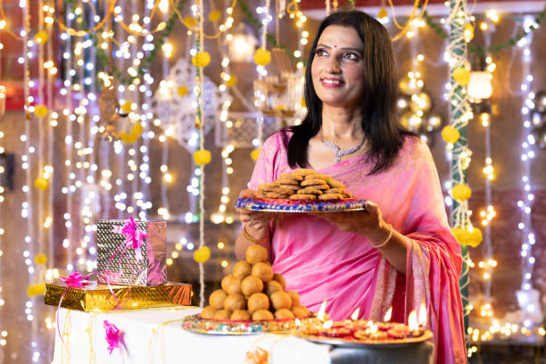 istock Woman Diwali Celebrate at home. 2151884123