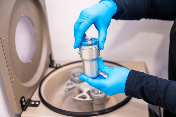 istock Expertise placing samples in a centrifuge machine in a laboratory 2151885176