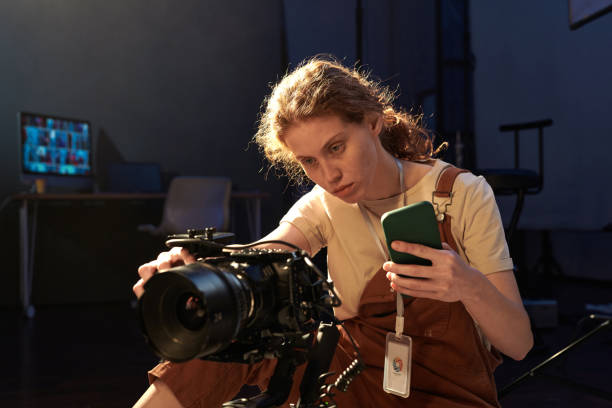 Woman setting up digital video camera