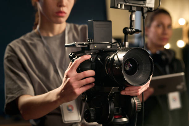 istock Female Hands Holding Professional Video Camera 2151886072