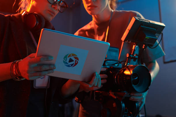 istock Video Production Crew Discussing Footage 2151886092