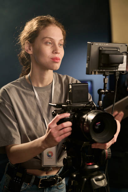 istock Camerawoman Operating Equipment on Set 2151886096