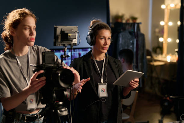 istock Female Director Giving Instructions To Crew 2151886100