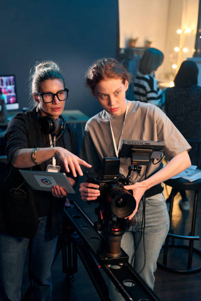 istock Camerawoman Operating Professional Video Camera 2151886114