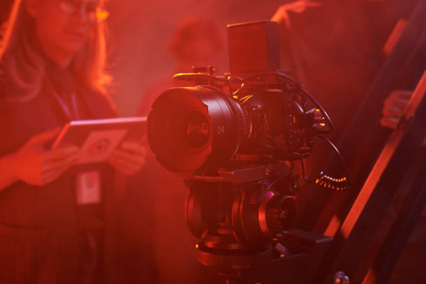 istock Background image of pro videocamera equipment in red light 2151886134