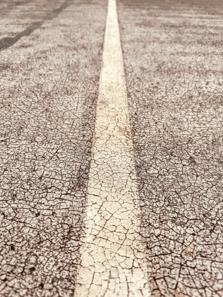 Old covering on a sports ground as an abstract background. Texture.