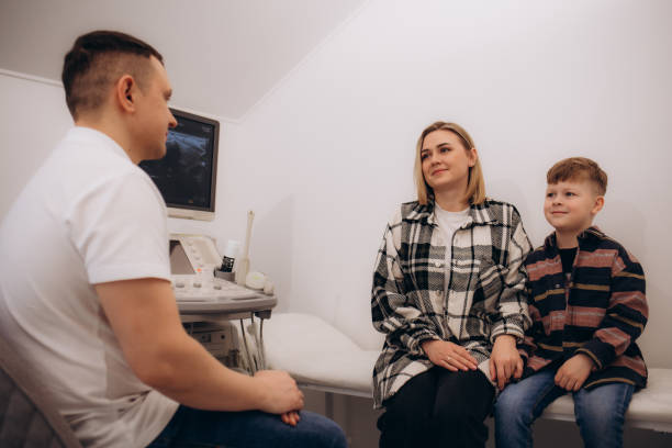 istock Woman with her son at doctor's office 2151892284