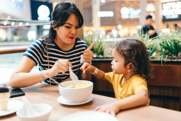 istock asian family dinner in a restaurant 2151895332