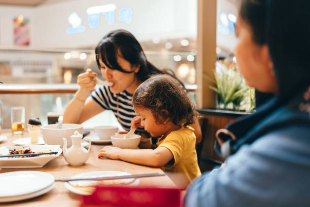 istock asian family dinner in a restaurant 2151895780