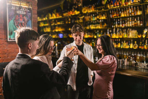 istock Friends cheers glasses with drinks celebrating meet at bar 2151896444
